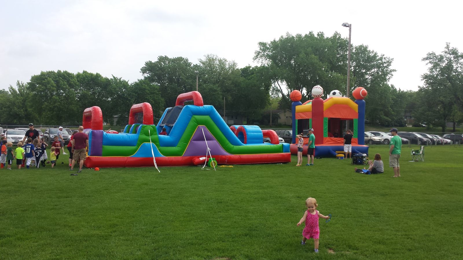 Wacky 7 Element Obstacle Course and Sports Bounce House at baseball event.